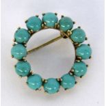 A ROUND BROOCH 585/000 yellow gold with turquoises. Diameter 27 cm long, gross weight