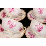 A SET OF 11 COFFEE CUPS WITH SAUCERS Meissen circa 1900 Painted with purple flowers and