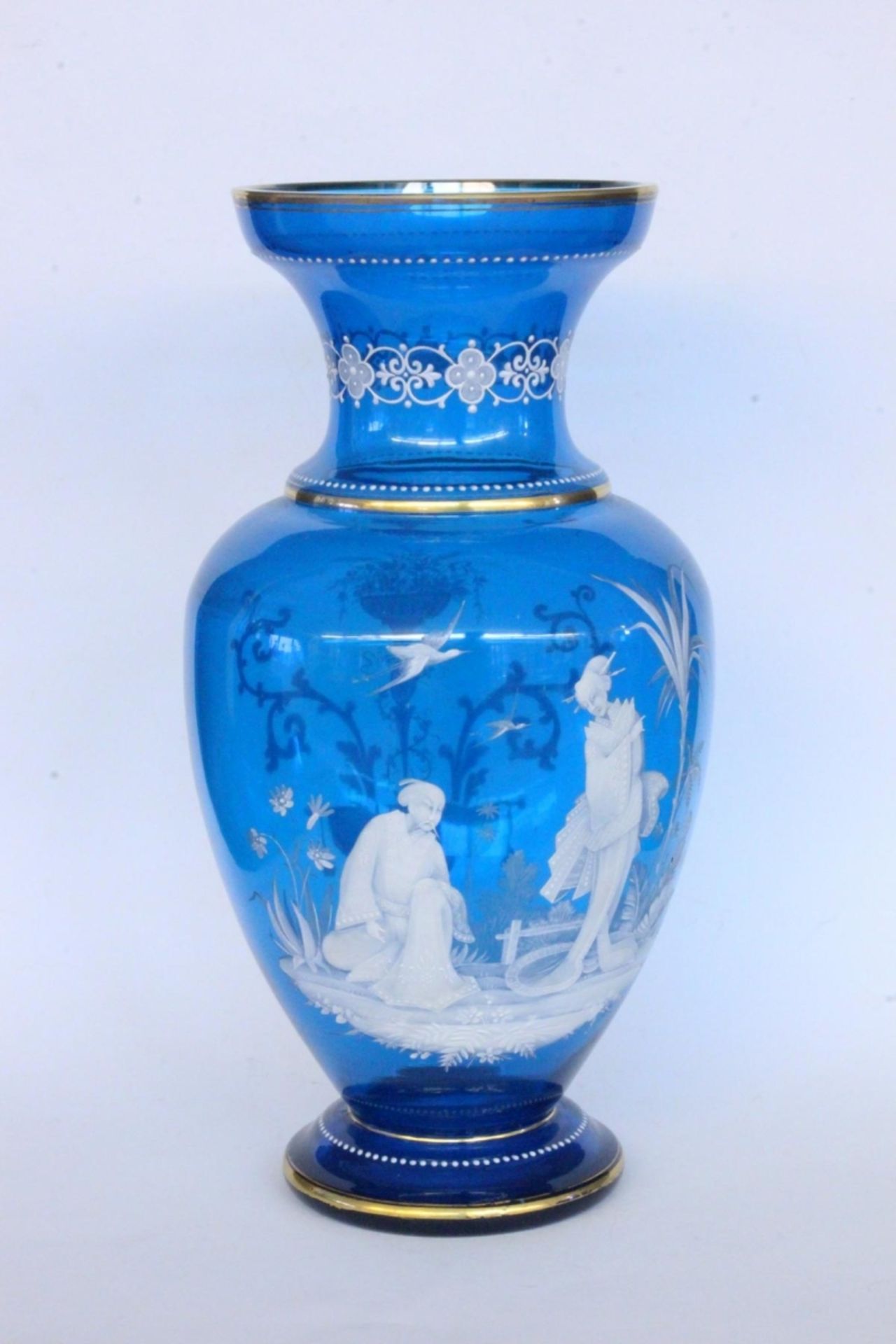 A VASE circa 1900 Blue glass with white enamel painting in Chinese style. 31.5 cm high.