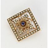AN ANTIQUE BROOCH 333/000 red gold with sapphire and seed pearls. 20 x 20 mm, gross weight