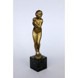 FRANZ IFLAND Berlin 1862 - 1935 Standing female nude. Bronze, gilt on marble base. Total