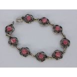 ARMBANDSilber vergoldet mit Rhodochrositen. L.18cmA BRACELET Silver, gold-plated with rhodoch