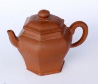 A TEA POT China, probably Qing Small Yxing pot made of reddish stoneware. Four character