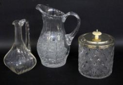 THREE GLASS ITEMS Crystal carafe, juice jug and biscuit box with metal lid and knob made