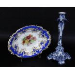 A FRUIT BOWL AND CANDLESTICK Circa 1900. Candlestick with blue painting, 31 cm high. Bowl