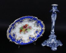 A FRUIT BOWL AND CANDLESTICK Circa 1900. Candlestick with blue painting, 31 cm high. Bowl