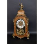 A DECORATIVE BOULLE CLOCK circa 1970 In Louis XV style. Wooden case with brass ornaments.