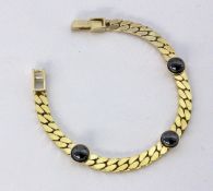 A CURB LINK BRACELET Silver, gold-plated with haematite. 18.5 cm long, gross weight