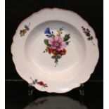 AN EMPIRE PLATE Meissen circa 1800 (Marcolini) Deep plate with coloured flowers. Blue