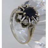 A LADIES RING 585/000 white gold with sapphire and brilliant cut diamonds. Ring size 60,