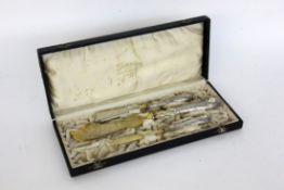 3-PIECE SERVING CUTLERY SET France circa 1900 Silver handles with gold-plated blades. Case