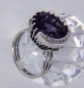 A LADIES RING 585/000 white gold with amethysts and brilliant cut diamonds. Ring size 55,