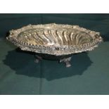 A large early 20th century silver plated swing handle Fruit Bowl, three footed circular form,