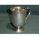 A George VI silver Christening Mug, U shape on stepped circular foot, S scroll handle, reserved with