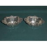 A pair of Edwardian silver Bon Bon Dishes, pierced oval form with embossed shaped rim, Walker and