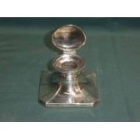 A mid century silver Capstan Ink Well, square canted form, hinged circular cover, glass well not