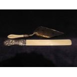 A large late Victorian silver and ivory Page Turner, heavily embossed silver handle featuring