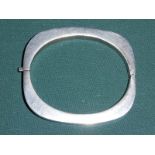 An Art Deco Mexican Silver hinged Bangle of rounded rectangular form, 7.5cm by 6.5cm