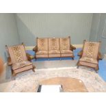 A mid 20th Century Continental carved wood, three seater, three piece suite with Tweed/Tapestry