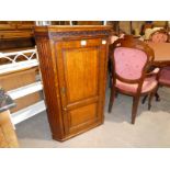 A Georgian oak flat front Wall Cabinet with single panelled door and canted corners