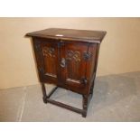 Small Oak gothic two door cabinet on frame base 67.5cm