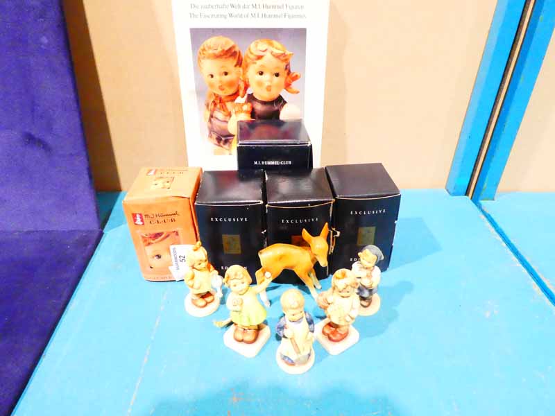 Five boxed Goebel figures of Children, a Goebel Fawn & a soft back book 'the Fascinating World of M.
