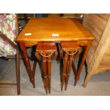 A reproduction Nest of three Tables incorporating a pair of drop leaf Tables