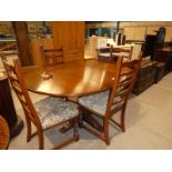 An Old Charm oval top extending Dining Table on single central support and a set of 4 ladderback