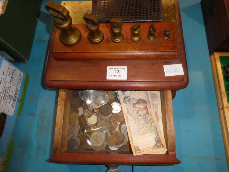 A set of 6 brass Bell Weights 1lb down to 1/2oz and a wooden drawer of mixed coins