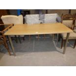 An Ikea Dining/Office Table on chrome legs