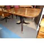 A Regency crossbanded mahogany tip top Breakfast Table on reeded triform support