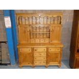 A 5ft long reclaimed pine Welsh Dresser of typical form with display back, 5ft long by 6ft high