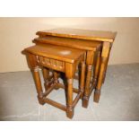 Nest of three golden Oak tables with Egg and Dart carved frieze, 58cm wide