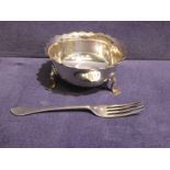 A small silver three footed Bowl and a silver Fork, 3.08oz