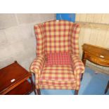 A Georgian style Wing Back Armchair in chequered upholstery