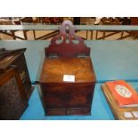 A Georgian mahogany Salt Box with fretwork top, sloping lid and single drawer