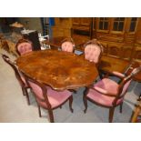 An Italian style inlaid and shaped oval top Dining Table and 6 Chairs inc a pair of Carvers