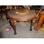 A carved top circular oriental Occasional Table, 57cm diameter