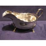 A silver four footed Sauce boat with S scroll handle, 3.6oz