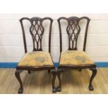 An early 20th century set of six mahogany Chippendale style Dining Chairs, carved and openwork