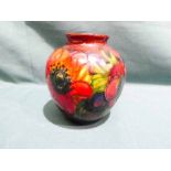A Moorcroft pottery Vase of squat baluster form with everted neck, tubeline decorated with