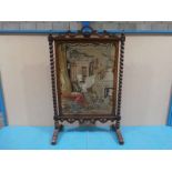 A large Victorian rosewood framed Fire Screen, fretwork crest above rectangular frame housing a