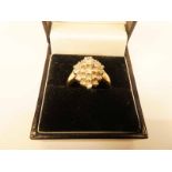 A 9ct gold diamond set oval cluster ring size P, 5.3g