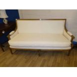 A French style show frame Sofa, rectangular back with outsplayed arms, and upholstered elbow pads,