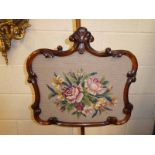 A Victorian mahogany Pole Screen, typical form, height adjustable rectangular scroll frame, with