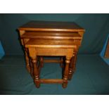 A modern oak nest of three graduated Occasional Tables, Jacobean style with rectangular tops, turned