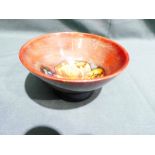 A small Walter Moorcroft pottery footed Bowl, tubeline decorated in a Claremont Toadstool design