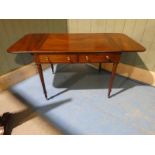 An early to mid 19th century mahogany Pembroke style Library Table, mounded edge cross banded