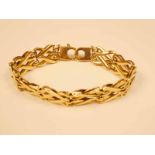 A 9ct gold double skin cross over gate link bracelet 18.5cm, 18.5g