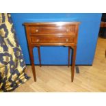 A reproduction Regency style mahogany effect two drawer side table, each drawer arranged one over